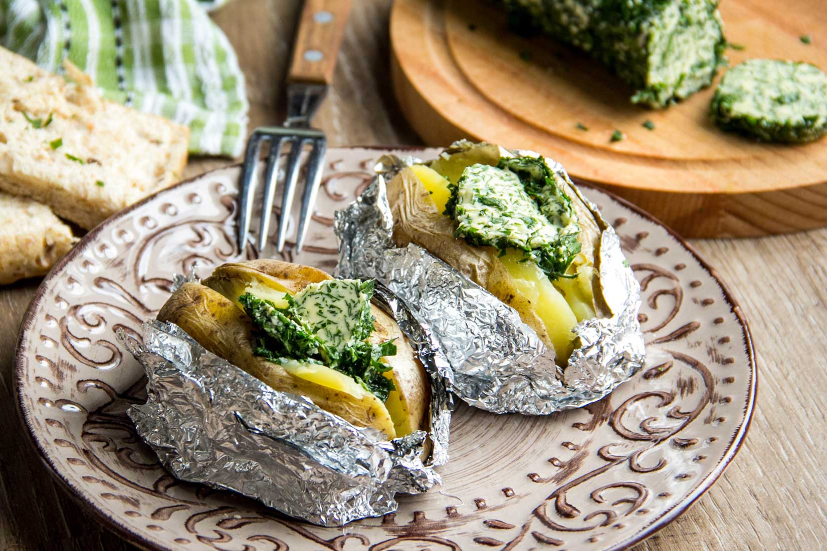 baked potatoes with herb butter