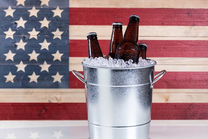 A bucket of cold bottled beer on ice