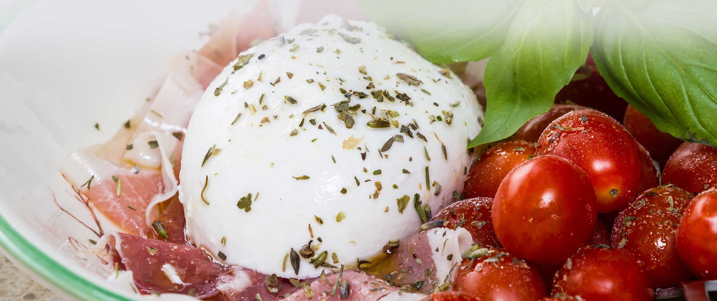 Caprese Salad with Roma® Ovoline Mozzarella, Grape Tomatoes, Fresh Basil and Roma® Prosciutto