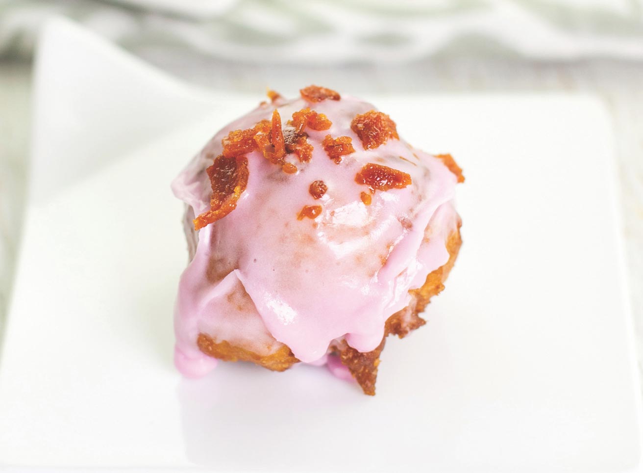 Beignet Topped with Pink Confectioners Glaze