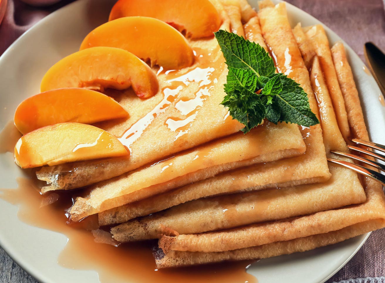 Crepes Filled with Red Wine Poached Peaches