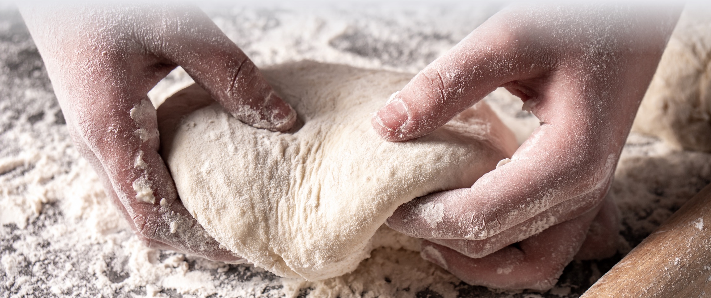 Chef kneading a ball of dough