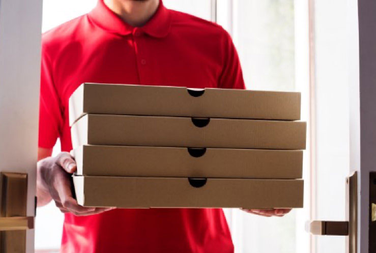 Delivery Person Holding Pizza Boxes